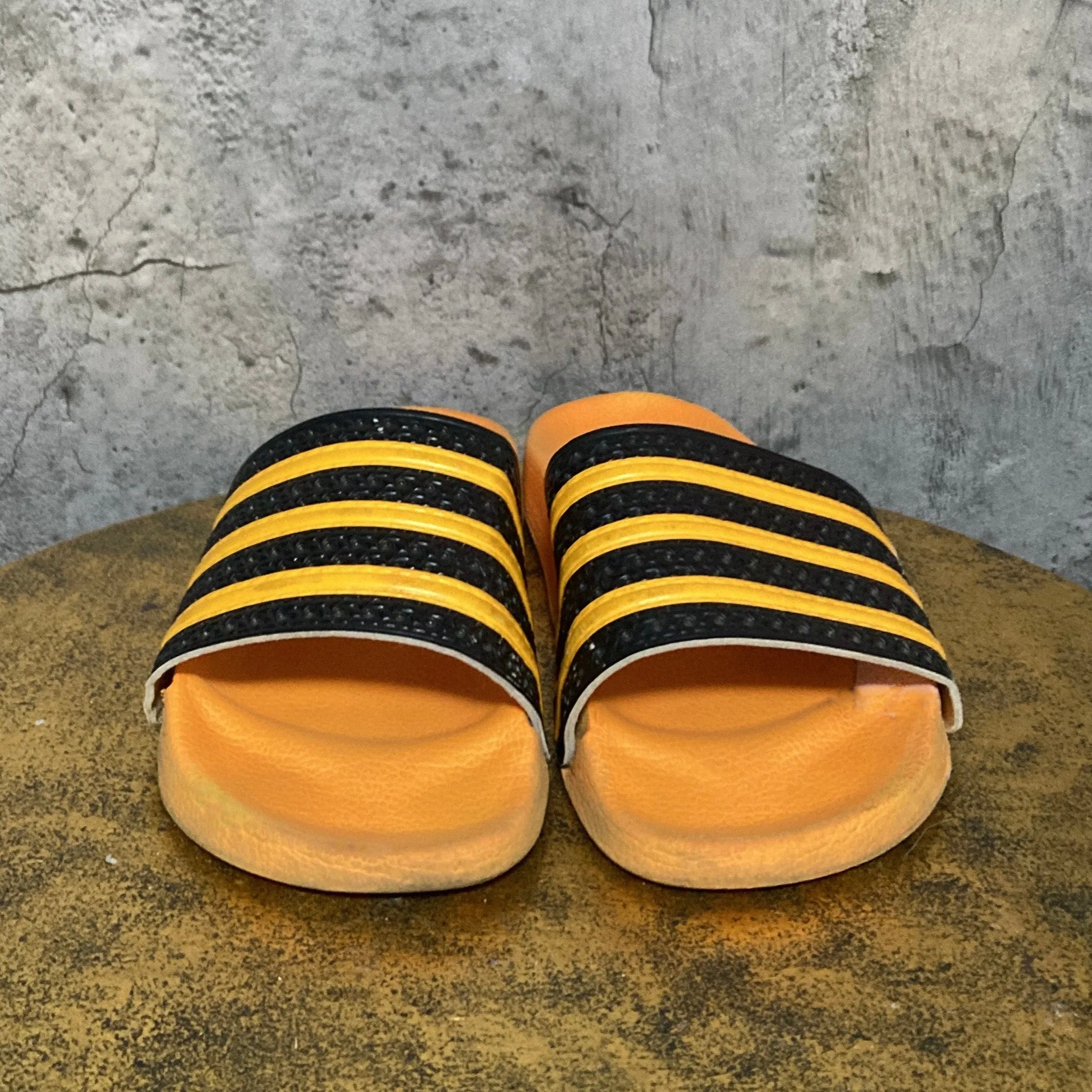 adilette by adidas orange black