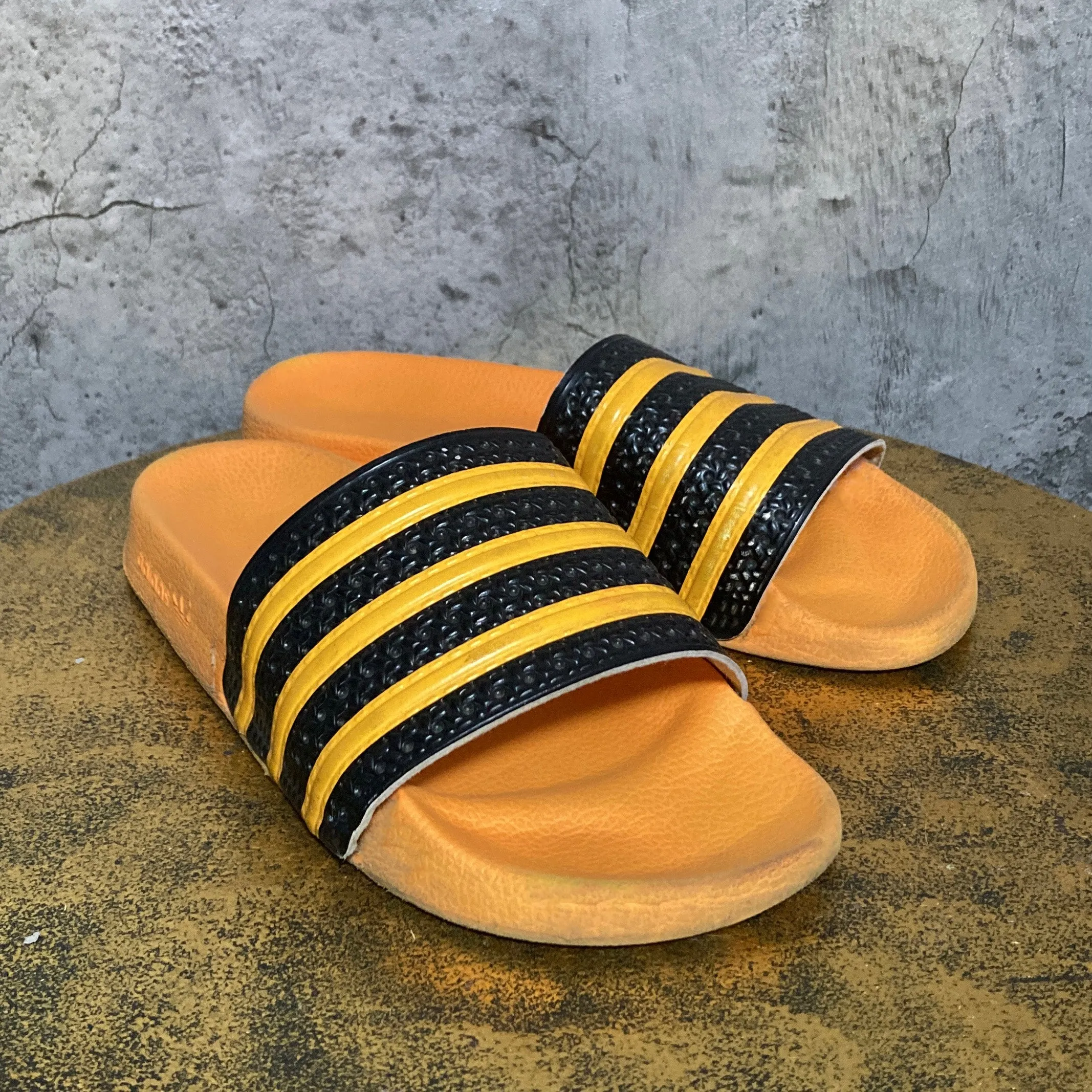 adilette by adidas orange black